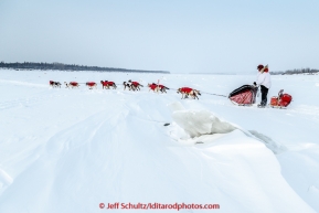 Ben Harper runs past ice chunks on the Yukon river after leaving the Tanana checkpoint on Wednesday morning  March 11th during the 2015 Iditarod.(C) Jeff Schultz/SchultzPhoto.com - ALL RIGHTS RESERVED DUPLICATION  PROHIBITED  WITHOUT  PERMISSION