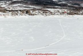 Two teams on the trail on the Yukon River withTananain the background on Wednesday afternoon  March 11th during the 2015 Iditarod.(C) Jeff Schultz/SchultzPhoto.com - ALL RIGHTS RESERVED DUPLICATION  PROHIBITED  WITHOUT  PERMISSION