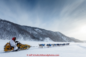 Mitch Seavey rests on his sled while his dogs lead him to the Ruby checkpoint of the Iditarod. On March 11, 2015.(C) Jeff Schultz/SchultzPhoto.com - ALL RIGHTS RESERVED DUPLICATION  PROHIBITED  WITHOUT  PERMISSION