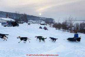 Martin Buser mushes up hill on the road into the Ruby checkpoint on Wednesday March 11, during Iditarod 2015.(C) Jeff Schultz/SchultzPhoto.com - ALL RIGHTS RESERVED DUPLICATION  PROHIBITED  WITHOUT  PERMISSION