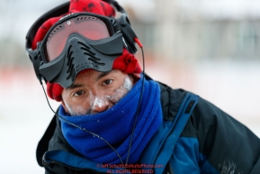 Ryan Redington keeps his frost-nipped face covered at the Huslia checkpoint during the 2017 Iditarod on Saturday morning March 11, 2017.Photo by Jeff Schultz/SchultzPhoto.com  (C) 2017  ALL RIGHTS RESERVED