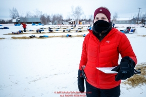 Volunteer Comms, Holly Bennett, is out gathering the latest information on in/out times to relay back to Iditarod HQ at the Huslia checkpoint during the 2017 Iditarod on Saturday morning March 11, 2017.Photo by Jeff Schultz/SchultzPhoto.com  (C) 2017  ALL RIGHTS RESERVED