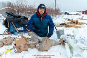 Ramey Smyth goes through his drop bags at the Kaltag village checkpoint on Sunday morning March 11th during the 2018 Iditarod Sled Dog Race -- AlaskaPhoto by Jeff Schultz/SchultzPhoto.com  (C) 2018  ALL RIGHTS RESERVED