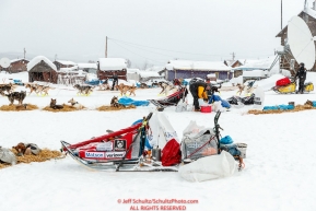 Matt Hall runs through the dog lot on his way through the Kaltag village checkpoint on Sunday morning March 11th during the 2018 Iditarod Sled Dog Race -- AlaskaPhoto by Jeff Schultz/SchultzPhoto.com  (C) 2018  ALL RIGHTS RESERVED