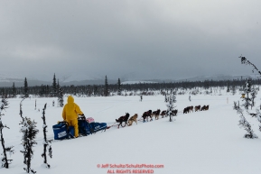 Sarah Stokey runs on the trail at the Tripod Flats cabin on the run from Kaltag to the Unalakleet checkpoint on Monday afternoon March 11th during the 2019 Iditarod Trail Sled Dog Race.Photo by Jeff Schultz/  (C) 2019  ALL RIGHTS RESERVED