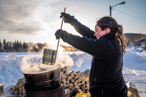 Veteran racer Laura NVeteran racer Laura Neese gathers hot water for mixing dog food while at the Takotna Checkpoint on March 11, 2020.eese gathers hot water for mixing dog food while at the Tokatna Checkpoing on March 11, 2020.