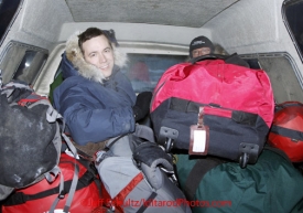 Sunday March 11, 2012  Volunteers get themselves and their gear moved from the bunkhouse to the airport in the back of a cold pickup at Unalakleet. Iditarod 2012.