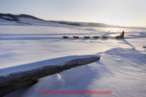 Sunday March 11, 2012  Anjanette Steer on the slough shortly after leaving Unalakleet in the morning. Iditarod 2012.