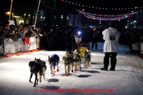 Mitch Seavey drives his team down Front Street in Nome first and winning his second Iditarod sled dog race on Tuesday March 12, 2013. Seavey made the journey from Willow in 9 days, 7 hours, 39 minutes, 56 seconds. Iditarod Sled Dog Race 2013Photo by Jeff Schultz copyright 2013 DO NOT REPRODUCE WITHOUT PERMISSION