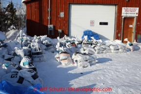 Musher food bags sit outside the firehall at the Elim checkpoint on Tuesday March 12, 2013.Iditarod Sled Dog Race 2013Photo by Jeff Schultz copyright 2013 DO NOT REPRODUCE WITHOUT PERMISSION