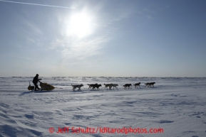 Mitch Seavey on a lagoon near Topkok on his way to Safety and Nome on Tuesday March 12, 2013.Iditarod Sled Dog Race 2013Photo by Jeff Schultz copyright 2013 DO NOT REPRODUCE WITHOUT PERMISSION