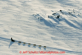 A team runs on the trail between Elim and White Mountain on Tuesday March 12, 2013.Iditarod Sled Dog Race 2013Photo by Jeff Schultz copyright 2013 DO NOT REPRODUCE WITHOUT PERMISSION