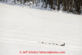 Aliy Zirkle runs on the Fish River shorlty after leaving White Mountain on Tuesday March 12, 2013.Iditarod Sled Dog Race 2013Photo by Jeff Schultz copyright 2013 DO NOT REPRODUCE WITHOUT PERMISSION