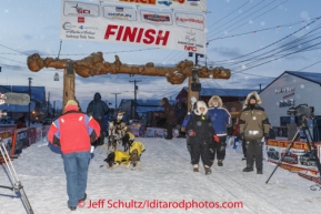 Abbie West at the Nome finish line on Front Steet on Wednesday March 12, during the 2014 Iditarod Sled Dog Race.PHOTO (c) BY JEFF SCHULTZ/IditarodPhotos.com -- REPRODUCTION PROHIBITED WITHOUT PERMISSION