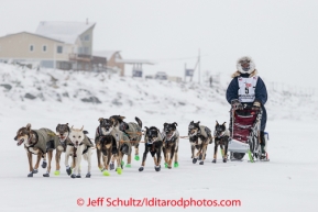 Dan Kaduce runs on the sea ice nearing the Nome finish line on Thursday March 13 during the 2014 Iditarod Sled Dog Race.PHOTO (c) BY JEFF SCHULTZ/IditarodPhotos.com -- REPRODUCTION PROHIBITED WITHOUT PERMISSION
