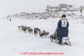 Dan Kaduce runs on the sea ice nearing the Nome finish line on Thursday March 13 during the 2014 Iditarod Sled Dog Race.PHOTO (c) BY JEFF SCHULTZ/IditarodPhotos.com -- REPRODUCTION PROHIBITED WITHOUT PERMISSION