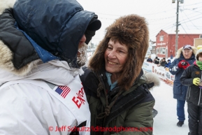 Jason Mackey gets a hug from his mom at the finish line in Nome on Thursday March 13 during the 2014 Iditarod Sled Dog Race.PHOTO (c) BY JEFF SCHULTZ/IditarodPhotos.com -- REPRODUCTION PROHIBITED WITHOUT PERMISSION