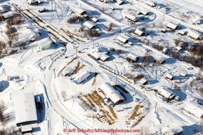 A team runs up the hill arriving in Ruby.in the afternoon on Thursday March 12, 2015 during  the 2015 Iditarod.(C) Jeff Schultz/SchultzPhoto.com - ALL RIGHTS RESERVED DUPLICATION  PROHIBITED  WITHOUT  PERMISSION