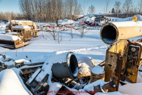 Many teams rest during their 24-hour layover amongst heavy machinery in the evening at the Galena checkpoint on Thursday March 12, 2015 during Iditarod 2015.  (C) Jeff Schultz/SchultzPhoto.com - ALL RIGHTS RESERVED DUPLICATION  PROHIBITED  WITHOUT  PERMISSION