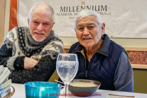 Jeff King shares his Millenium Hotel first musher to the Yukon dinner award with Paddy Nollner at Galena on Thursday March 12, 2015 during Iditarod 2015.  Paddy is the son of original 1925 serum musher Edgar Nollner.  (C) Jeff Schultz/SchultzPhoto.com - ALL RIGHTS RESERVED DUPLICATION  PROHIBITED  WITHOUT  PERMISSION