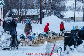 Volunteers help park Jim Laniers team in the morning on Thursday March 12, 2015 at the Ruby checkpoint during Iditarod 2015.(C) Jeff Schultz/SchultzPhoto.com - ALL RIGHTS RESERVED DUPLICATION  PROHIBITED  WITHOUT  PERMISSION