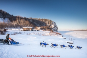 Jerry Sousa drops onto the Yukon River shorlty after leaving the Ruby Checkpoint in the morning on Thursday March 12, 2015 during Iditarod 2015.(C) Jeff Schultz/SchultzPhoto.com - ALL RIGHTS RESERVED DUPLICATION  PROHIBITED  WITHOUT  PERMISSION