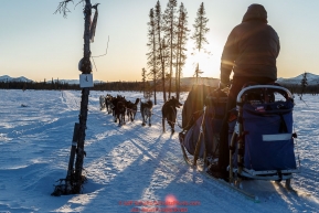 Scott Smith and team run down the trail near sunset after leaving the Kaltag checkpoint on Saturday March 12th during the 2016 Iditarod.  Alaska    Photo by Jeff Schultz (C) 2016  ALL RIGHTS RESERVED