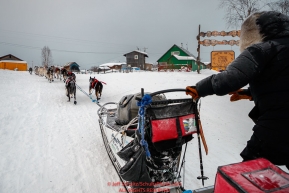 John Baker runs up the Yukon riverbank as he gets into the Kaltag checkpoint during the 2017 Iditarod on Sunday morning March 12, 2017.Photo by Jeff Schultz/SchultzPhoto.com  (C) 2017  ALL RIGHTS RESERVED