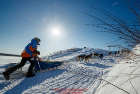 Mats Pettersson runs up the bank of the Yukon River and into  the Kaltag checkpoint during the 2017 Iditarod on Sunday afternoon March 12, 2017.Photo by Jeff Schultz/SchultzPhoto.com  (C) 2017  ALL RIGHTS RESERVED