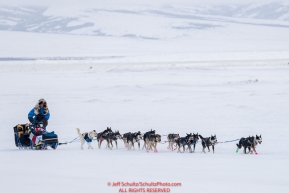 Larry Daugherty runs on the slough as he arrives at the Unalakleet checkpoint on Monday  afternoon March 12th during the 2018 Iditarod Sled Dog Race -- AlaskaPhoto by Jeff Schultz/SchultzPhoto.com  (C) 2018  ALL RIGHTS RESERVED