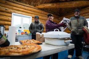 Dawn Greenway, from Ruby, drops off homemade pizza for the volunteers at the checkpoint on March 12, 2020.