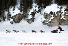 Tuesday March 13, 2012  Aliy Zirkle kicks as she runs down the Fish River after leaving in second place from White Mountain. Iditarod 2012.