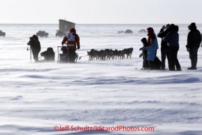 Tuesday March 13, 2012 Dallas Seavey is greeted by well-wishers from Nome about 4 miles from the finish line on the sea ice just prior to arriving in Nome. Iditarod 2012.