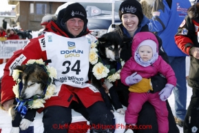 Tuesday March 13, 2012  Iditarod 2012 winner Dallas Seavey and his wife Jen and daughter Annie with his lead dogs at the finish line in Nome.