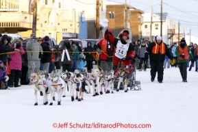 Tuesday March 13, 2012   Aliy Zirkle waves to the crowd as she enters the finish chute to Nome. Iditarod 2012.