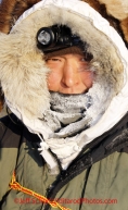 Tuesday March 13, 2012  Mike Williams, Jr. bundled up at the White Mountain checkpoint. Iditarod 2012.