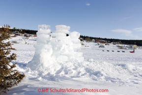 Tuesday March 13, 2012  Sigrid Ekran arrives in White Mountain, passing by ice blocks chopped to make a hole in the ice for water. Sigrid will remain in White Mountain for 8 hours for a mandatory layover. Iditarod 2012.