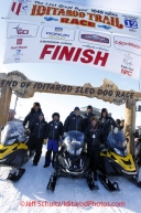 Tuesday March 13, 2012  The Trail Breakers pose for a photo at the finish line in Nome. Iditarod 2012.