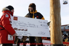 Tuesday March 13, 2012   from Wells Fargo Bank gives Dallas Seavey his winning check shorlty after Dallas won the 2012 Iditarod