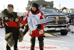 Tuesday March 13, 2012  Dallas Seavey is presented with the key to a new Dodge Ram pickup from Anchorage Chrysler Dodge representative Chuck Talskey at the finish line in Nome shorlty after Dallas won the 2012 Iditarod.