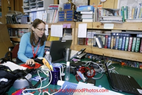 Tuesday March 13, 2012  Volunteer communications Janis Young mans the computer at White Mountain. Iditarod 2012.