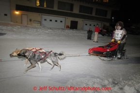 Jeff King runs down Front Street in Nome on is way to the dog lot after finishing in 3rd place early Wednesday morning March 13, 2013.Iditarod Sled Dog Race 2013Photo by Jeff Schultz copyright 2013 DO NOT REPRODUCE WITHOUT PERMISSION