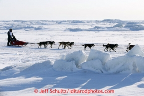 Mike Williams Jr.  runs on the Bering Sea several miles before the finish line in Nome on Wednesday March 13, 2013. Iditarod Sled Dog Race 2013Photo by Jeff Schultz copyright 2013 DO NOT REPRODUCE WITHOUT PERMISSION