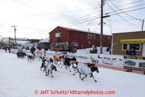 Martin Buser runs down Front Street and into the finish chute to place 17th in Nome on Wednesday March 13, 2013. Iditarod Sled Dog Race 2013Photo by Jeff Schultz copyright 2013 DO NOT REPRODUCE WITHOUT PERMISSION