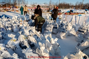 Volunteers at Huslia ready musher food bags in the afternoon at the Huslia checkpoint on Friday March 13, 2015 during Iditarod 2015.  (C) Jeff Schultz/SchultzPhoto.com - ALL RIGHTS RESERVED DUPLICATION  PROHIBITED  WITHOUT  PERMISSION