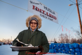 Volunteer checker and Huslia resident Rosie Simon awaits another musher in the evening at the Huslia checkpoint on Friday March 13, 2015 during Iditarod 2015.  (C) Jeff Schultz/SchultzPhoto.com - ALL RIGHTS RESERVED DUPLICATION  PROHIBITED  WITHOUT  PERMISSION