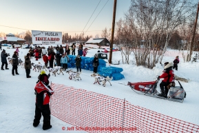 A big group of spectators is on hand in the evening at the Huslia checkpoint to see Aliy Zirkle arrive on Friday March 13, 2015 during Iditarod 2015.  (C) Jeff Schultz/SchultzPhoto.com - ALL RIGHTS RESERVED DUPLICATION  PROHIBITED  WITHOUT  PERMISSION