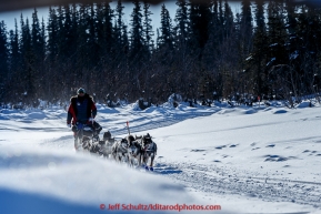 Nathan Schroeder runs on a slough after leaving Galena in the morning on Friday March 13, 2015 during Iditarod 2015.  (C) Jeff Schultz/SchultzPhoto.com - ALL RIGHTS RESERVED DUPLICATION  PROHIBITED  WITHOUT  PERMISSION