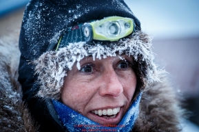 Jodi Bailey is all smiles after coming off the last stretch of Yukon River running in the morning at the Kaltag checkpoint on Sunday March 13th during the 2016 Iditarod.  Alaska    Photo by Jeff Schultz (C) 2016  ALL RIGHTS RESERVED