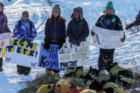 Brent Sass, first musher to reach Koyuk, is greeted by students with welcome signs at the Koyuk checkpoint on Sunday March 13th during the 2016 Iditarod.  Alaska    Photo by Jeff Schultz (C) 2016  ALL RIGHTS RESERVED